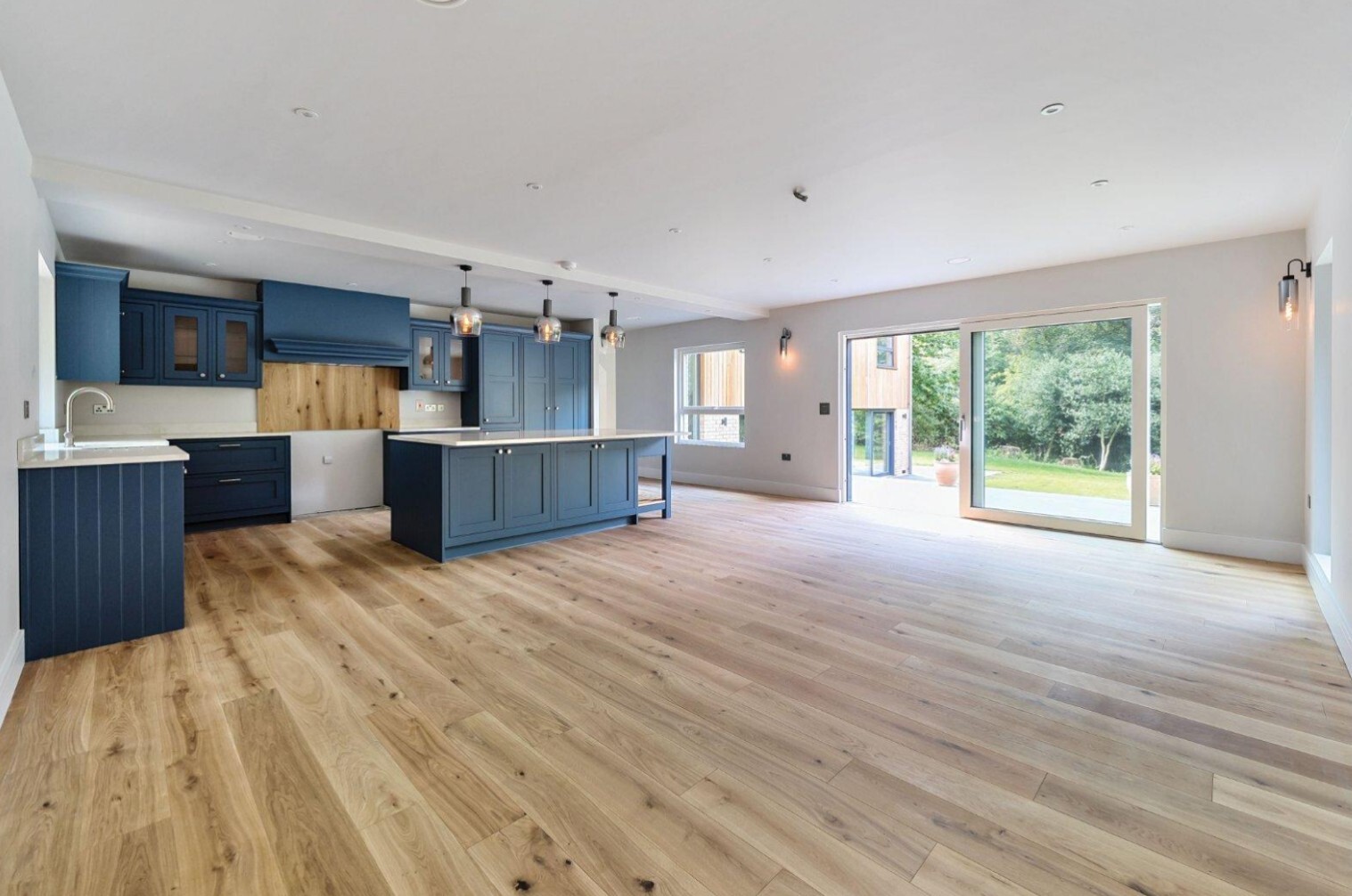 triple-aspect dining kitchen with shaker-style fitted furniture